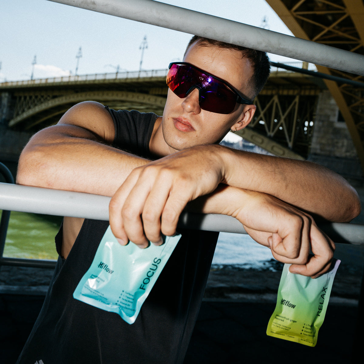 Male model holding Hiflow gum pouches.