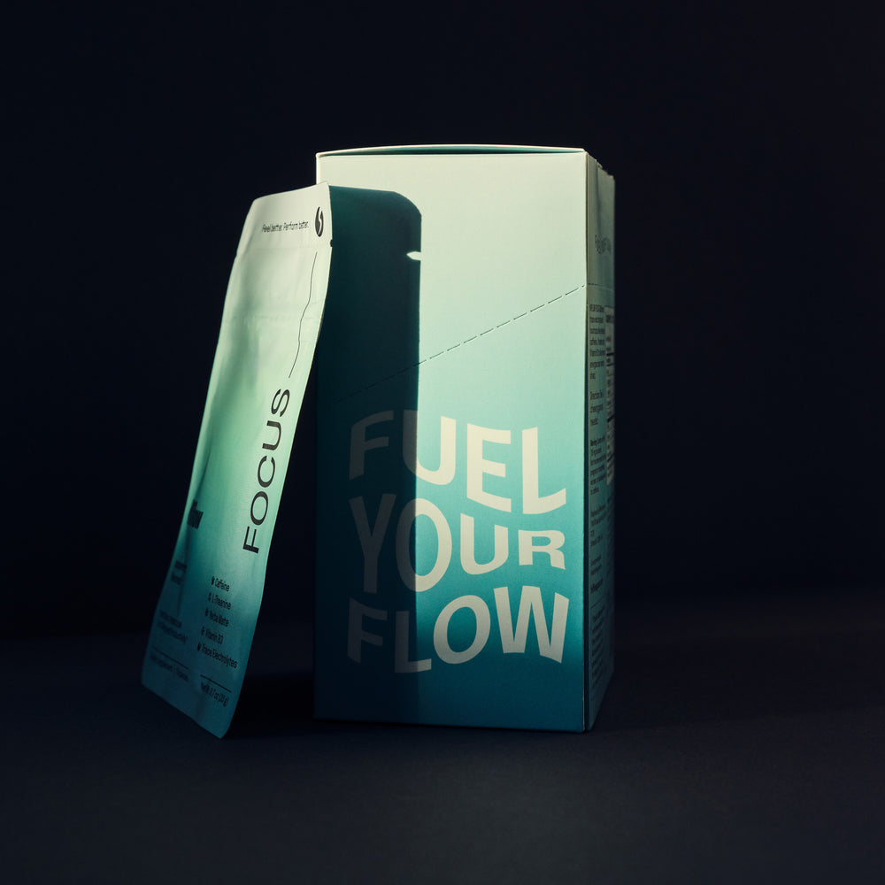 Teal Hiflow box with 'Fuel Your Flow' text, shot on a black background