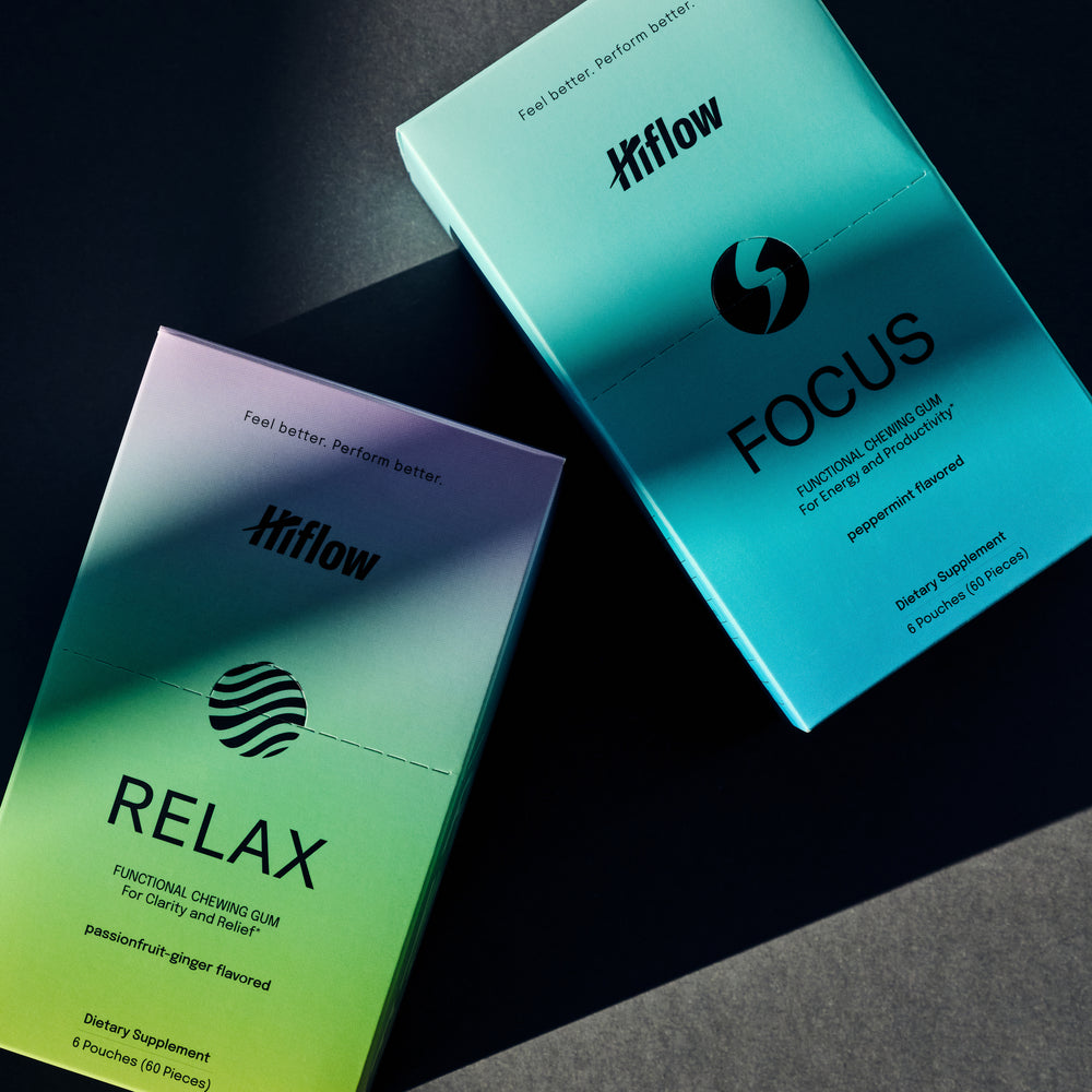 Clean photoshoot of a Hiflow Relax and Focus gum box on a dark background.