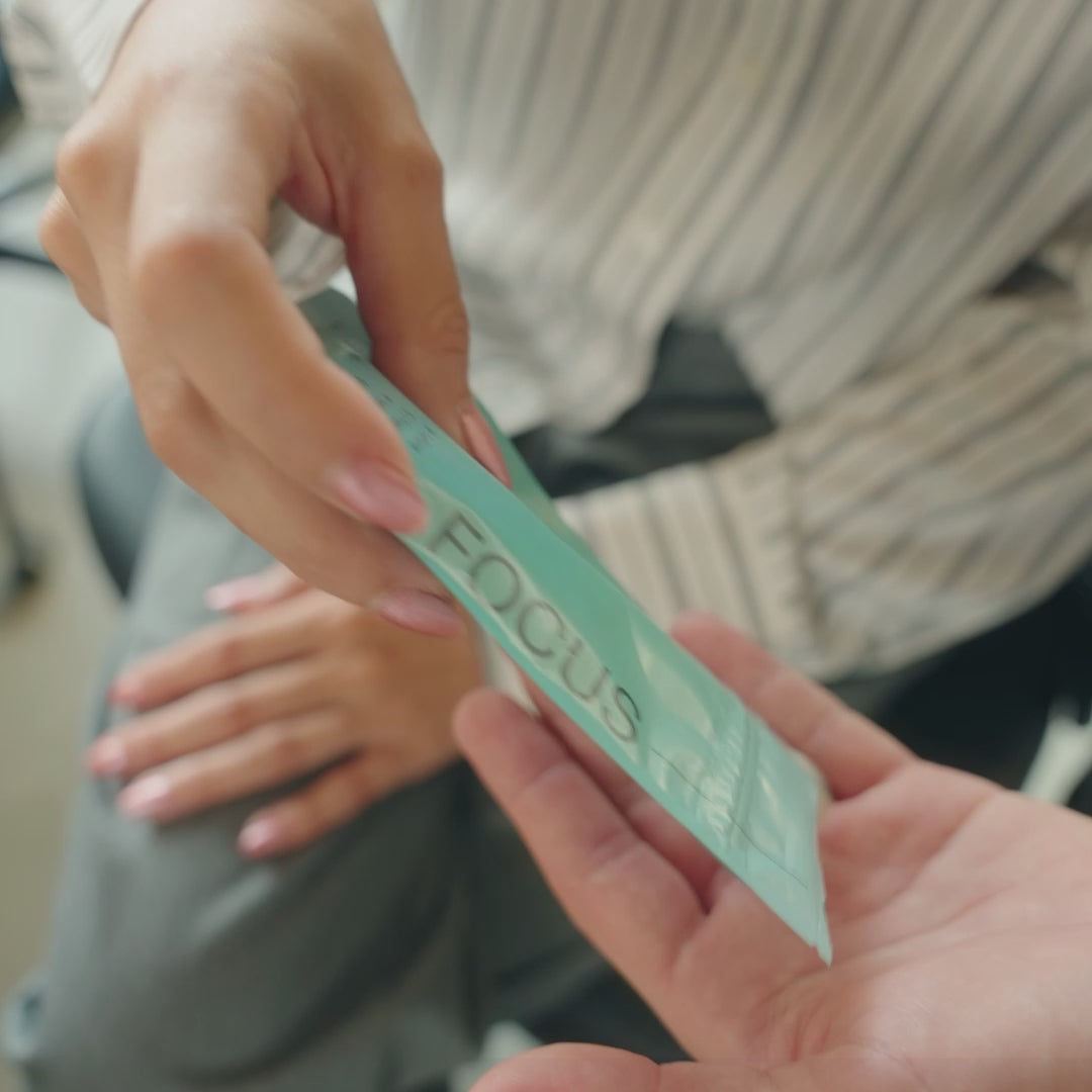 Load video: Promotional 'mood' video of young individuals in an office setting. They take Hiflow's Focus and Relax gums for performance.
